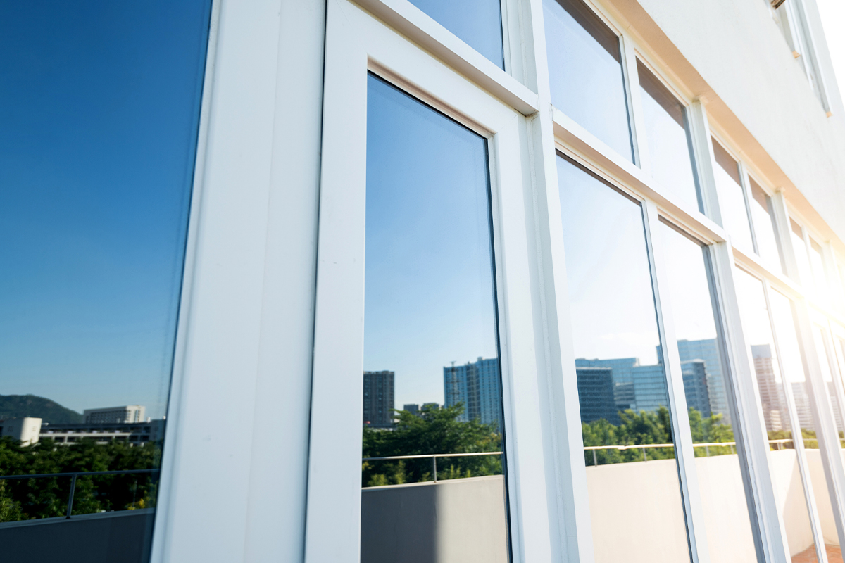 tempered glass on a building reflecting the Clearwater skyline.